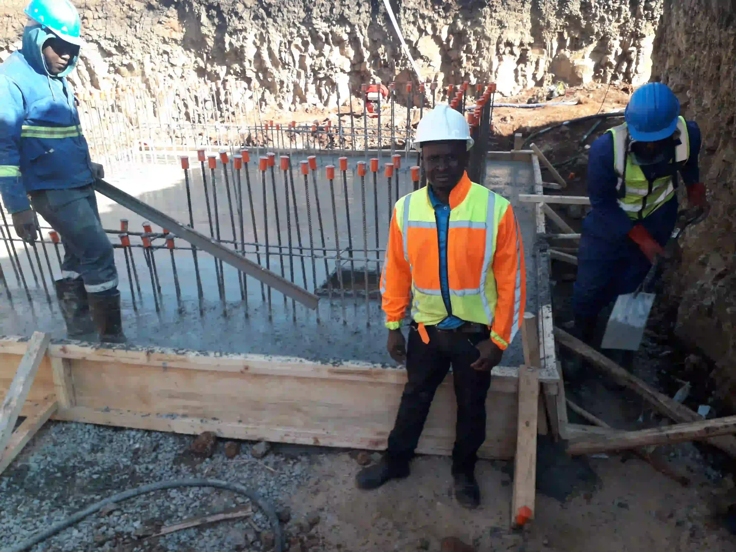 Construction crew finishing a concrete pour, Rand Water M11 Contract